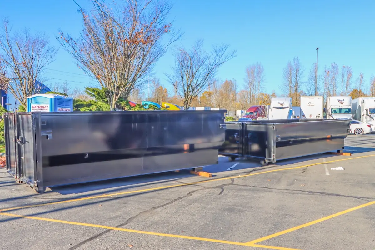 Professional dumpster rental service with roll-off container on residential driveway in Zephyrhills South